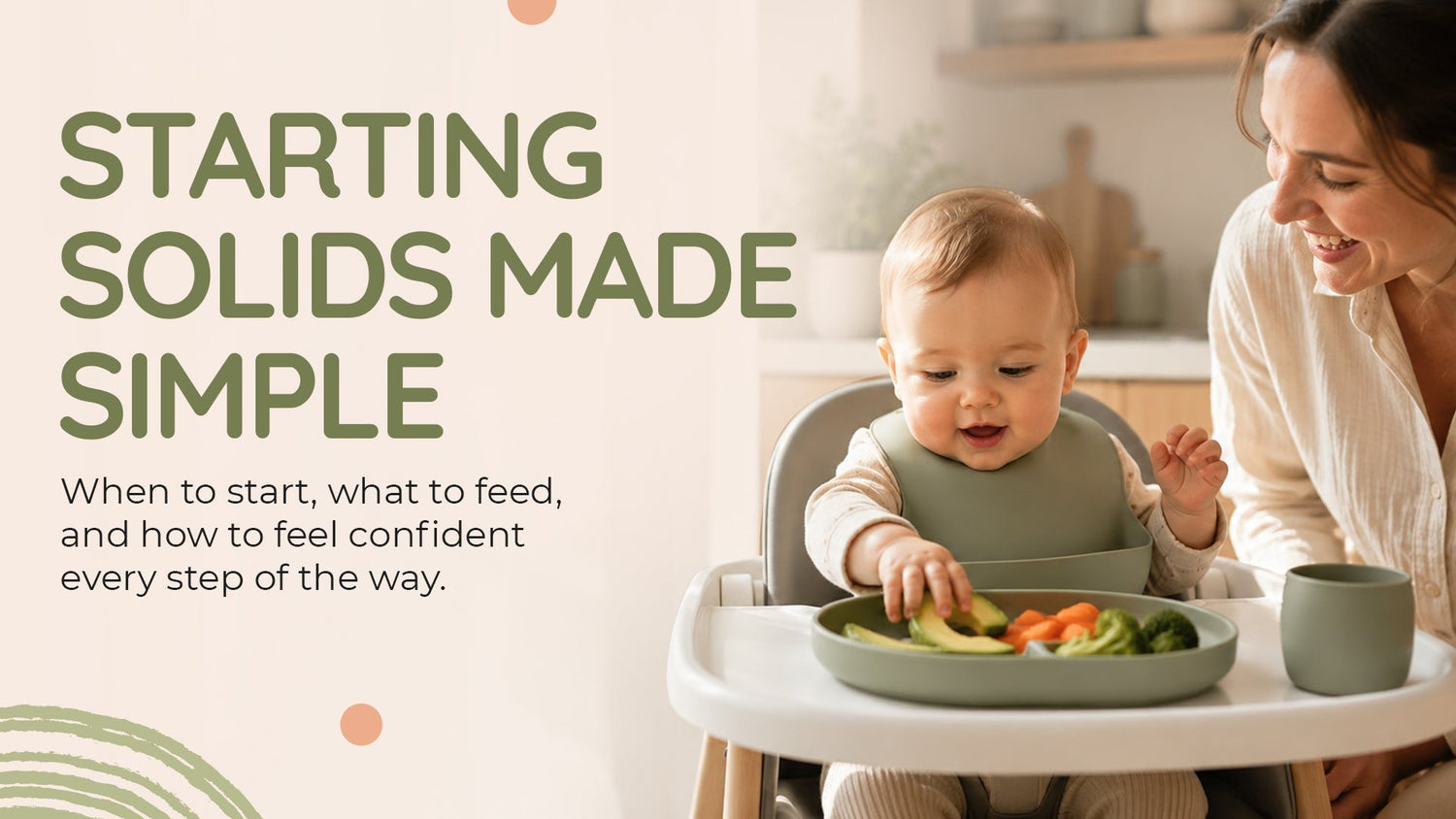 A baby sitting in a high chair exploring avocado and carrot finger foods, representing a simple approach to starting solids for Australian parents.